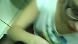 Four eyed brunette gives blowjob and gets laid in the toilet